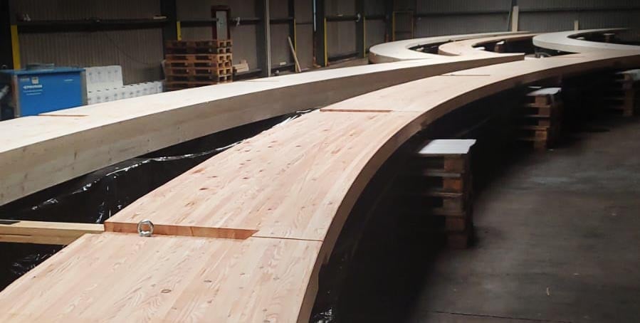 Buckland Timber Glulam curves laid out ready to be sprayed with Nordtreat